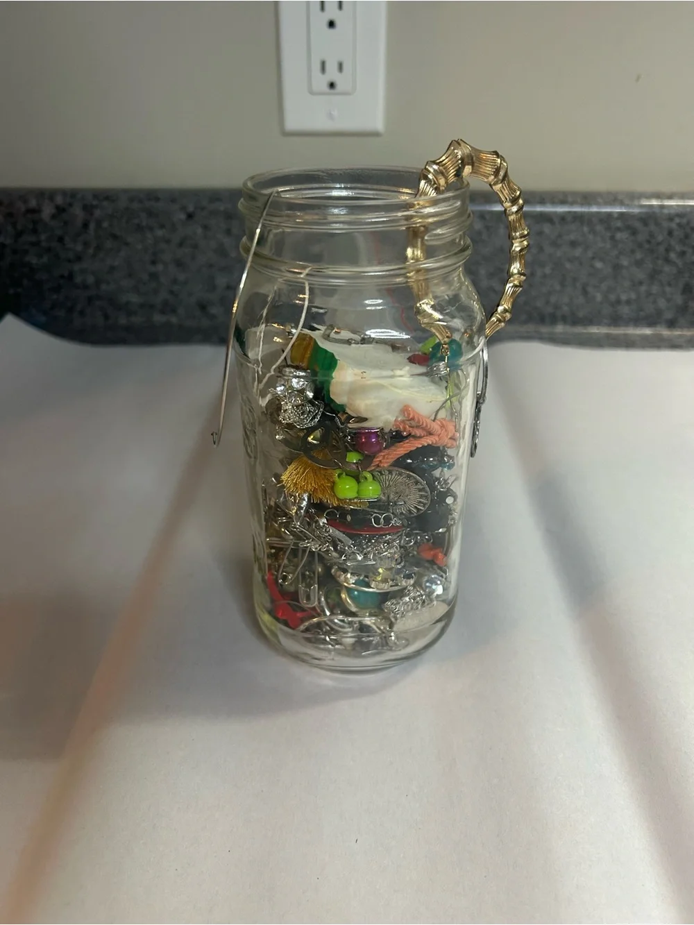 Jar full of crafting jewelry. Vintage to modern.